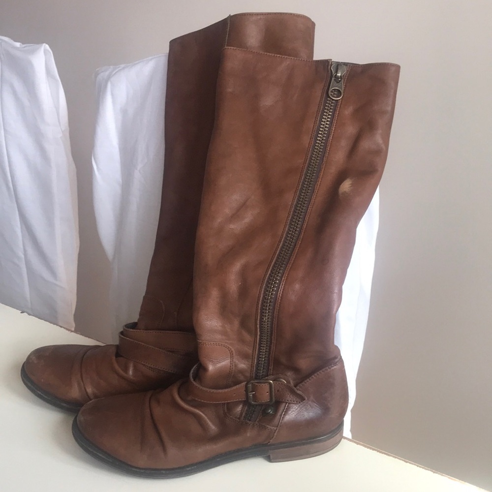 Saviore distressed double buckle leather boots.